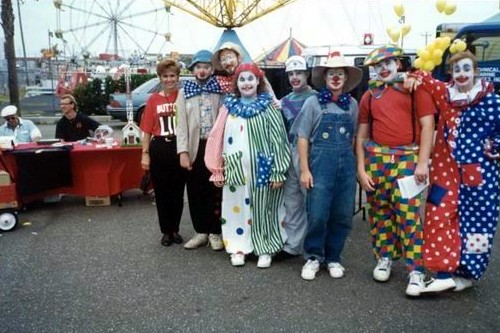 Clowns at Shrimp Festival with WBHY table in back