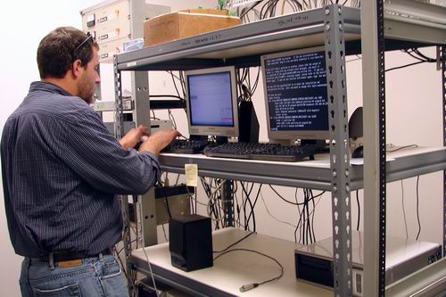 Mike Francis sets up servers for audio to transmitter